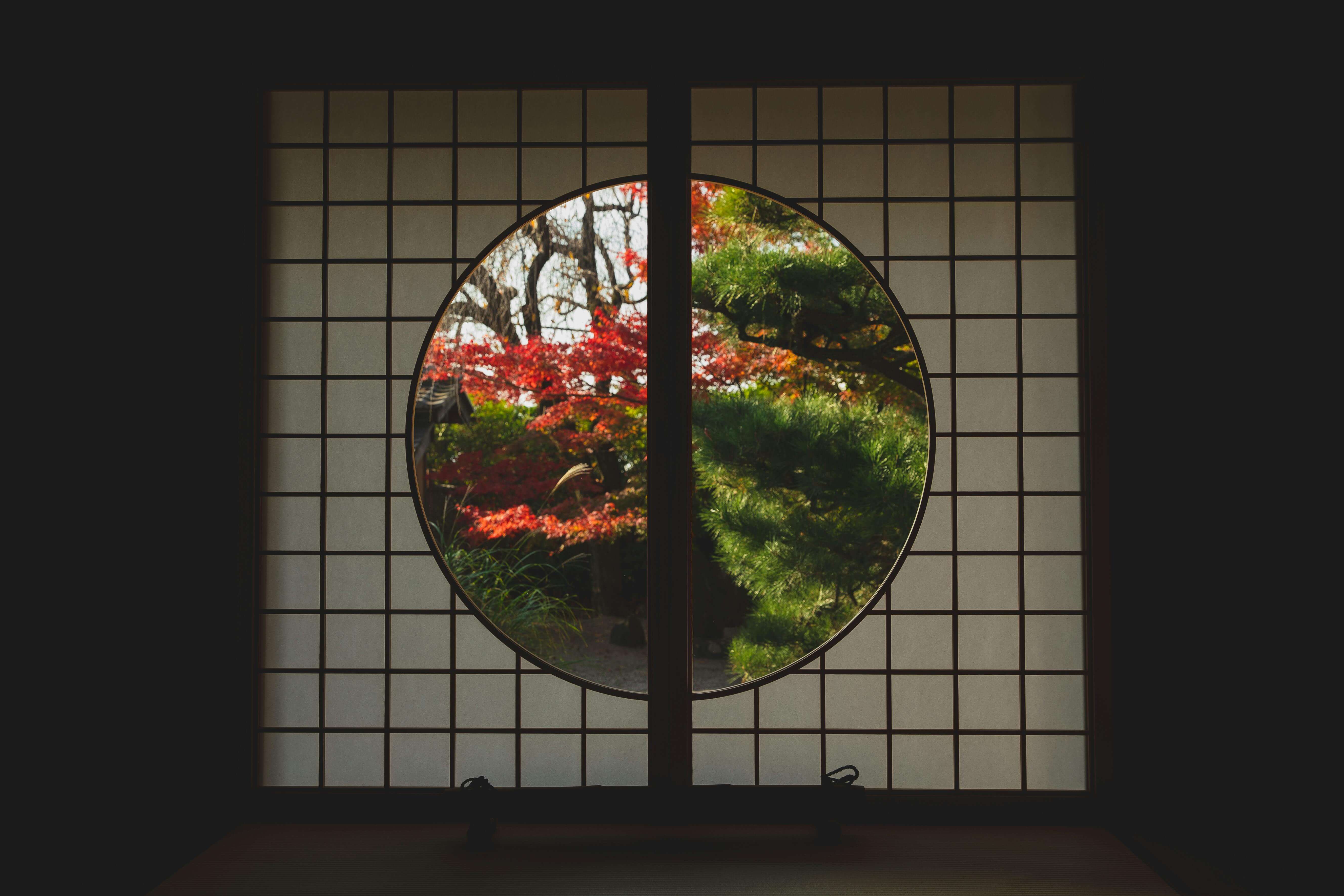Traditional Japanese garden view through circular window